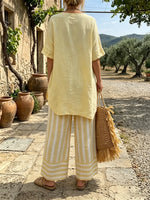 Women's Yellow Asymmetrical Top and Striped Pants Set