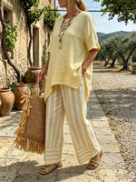Women's Yellow Asymmetrical Top and Striped Pants Set